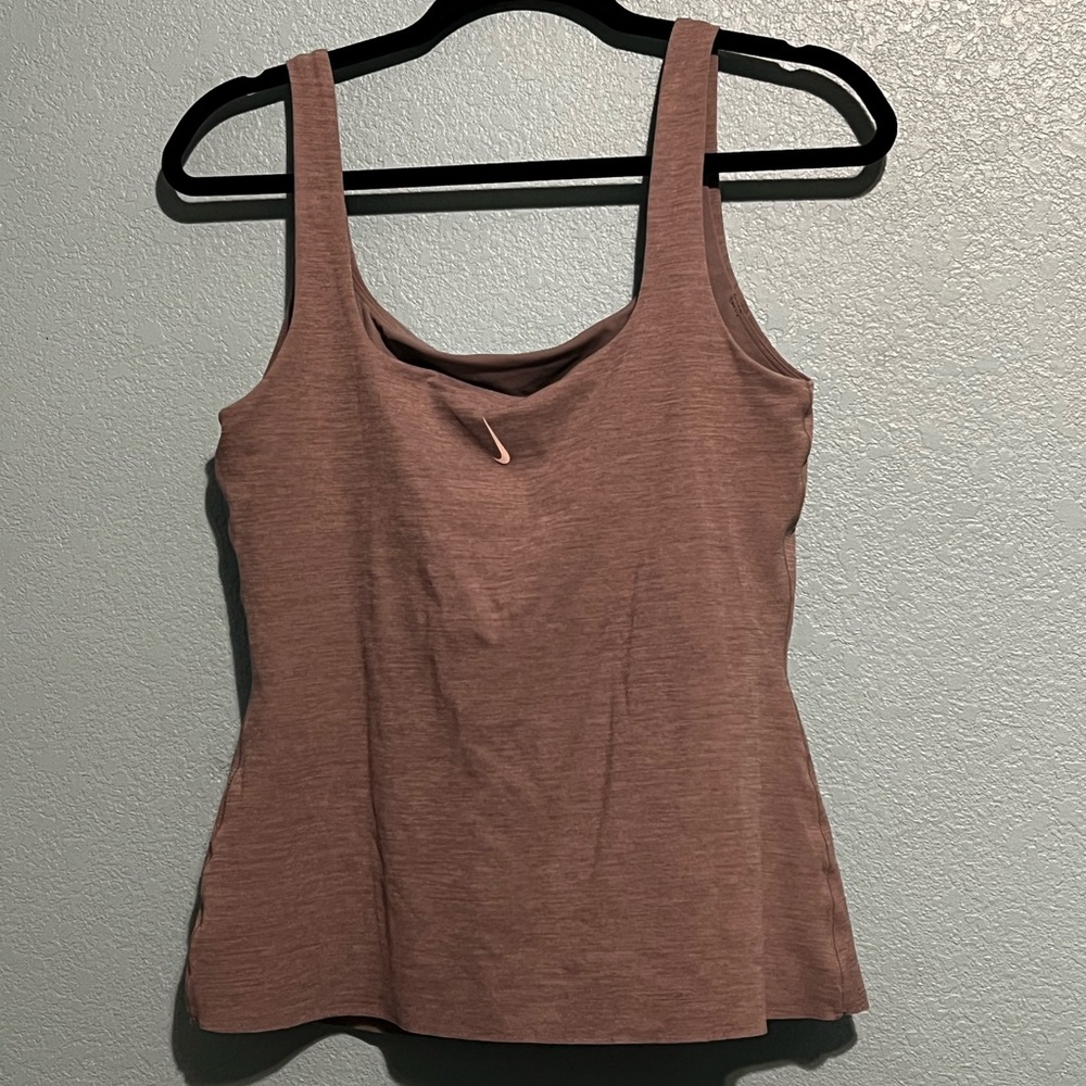 Nike sports top with a built in bra from their yoga collection. Size M